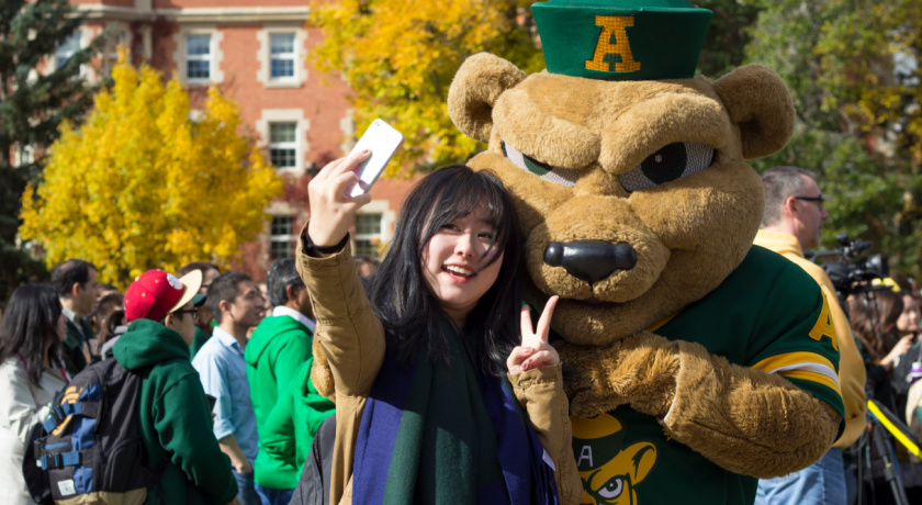 Student taking a selfie with Guba 