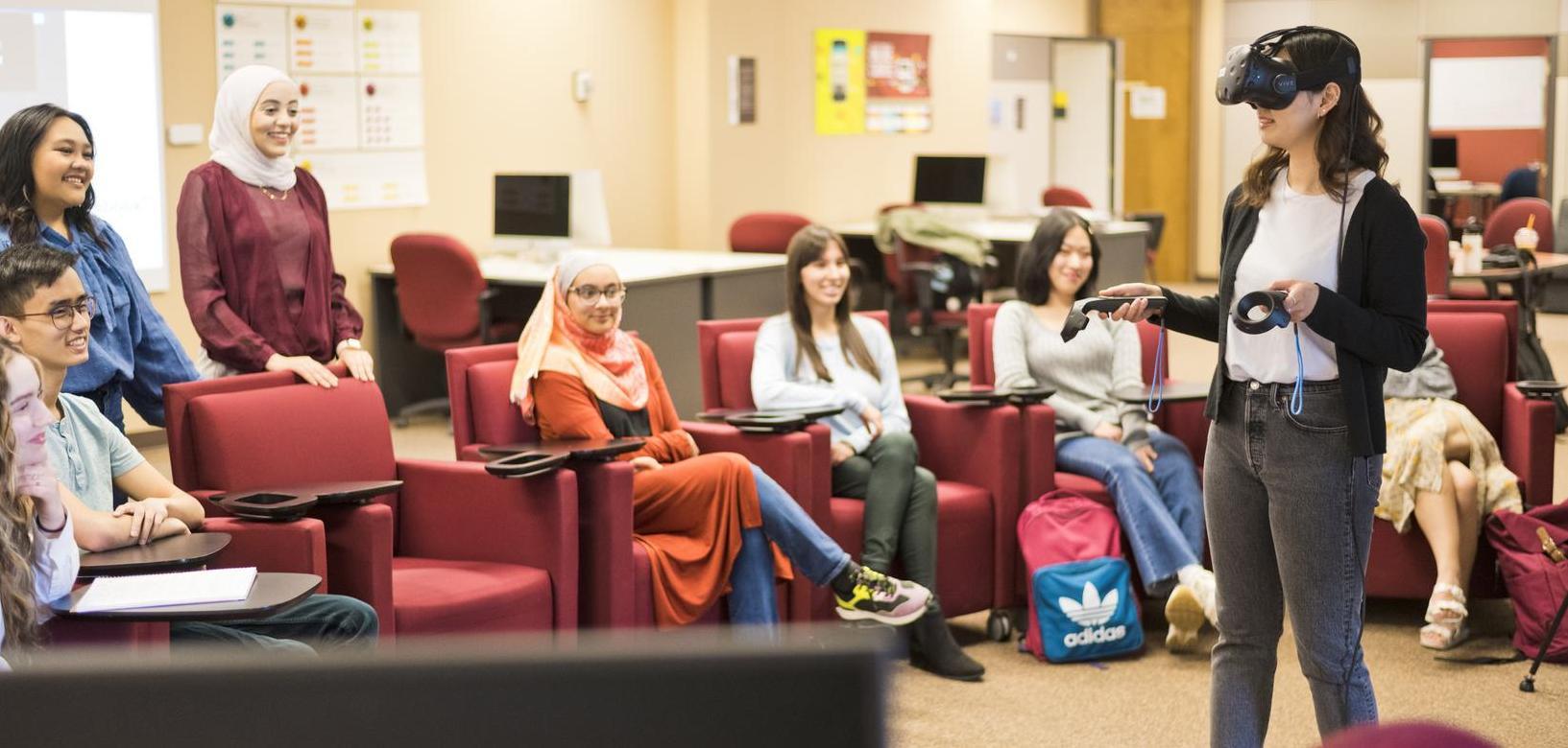 Students walking up steps in the interior of the Education Building