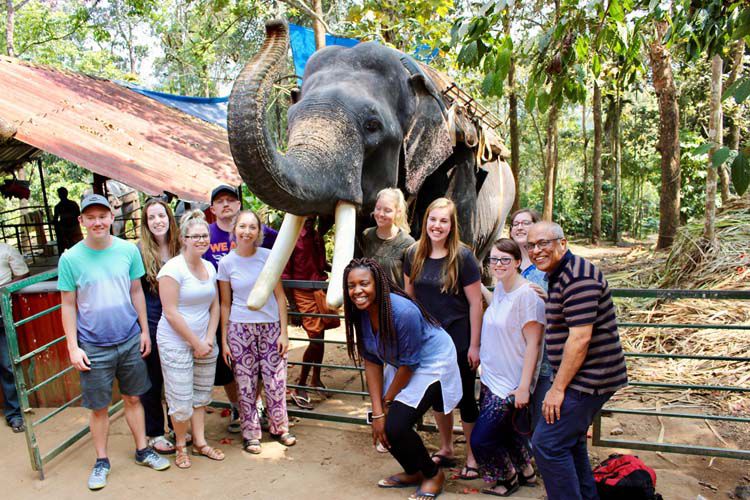 Professor Manaloor [far right] with students