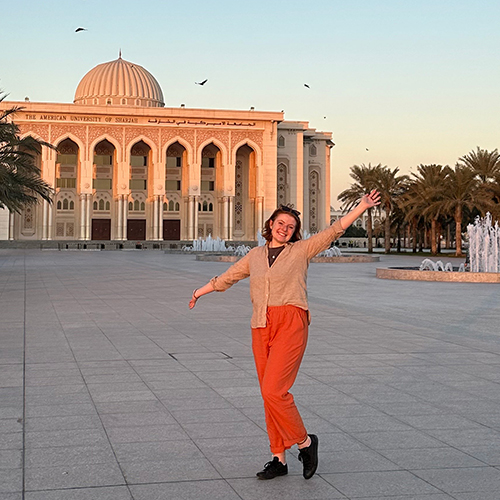 Emily in front of main building