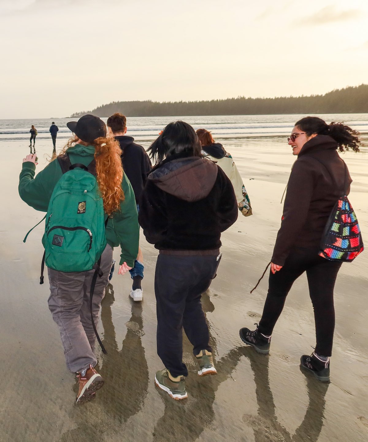 Students walking along a beach at an experiential learning session in Bamfield Marine Centre