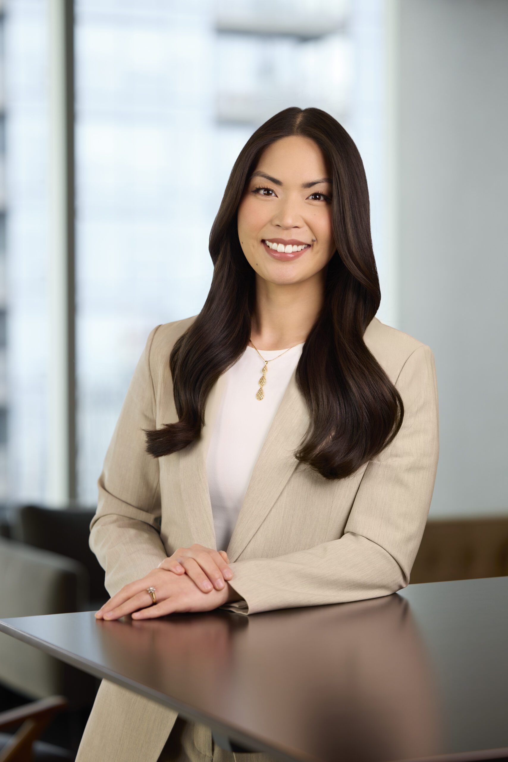 Melanie Williams standing behind a desk