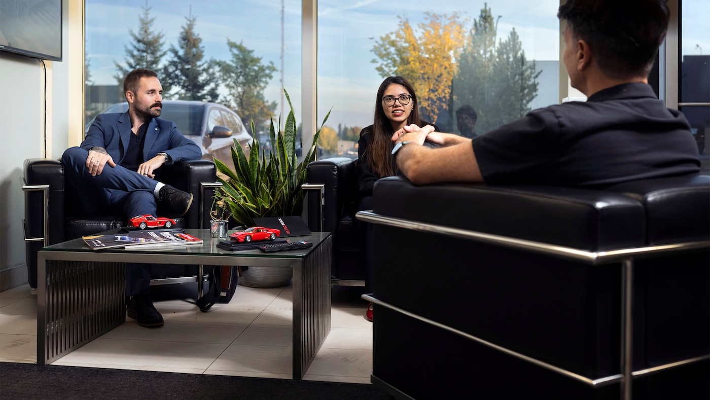 Leland Morrison and Samara Sayeed meet with Entrepreneurial Law Clinic client Francesco Auricchiella in an office seating area
