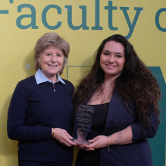 A student receives an award at the annual Celebration of Mooting event