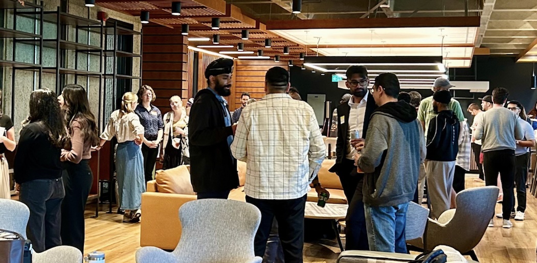 Law students and faculty gathering in the lounge
