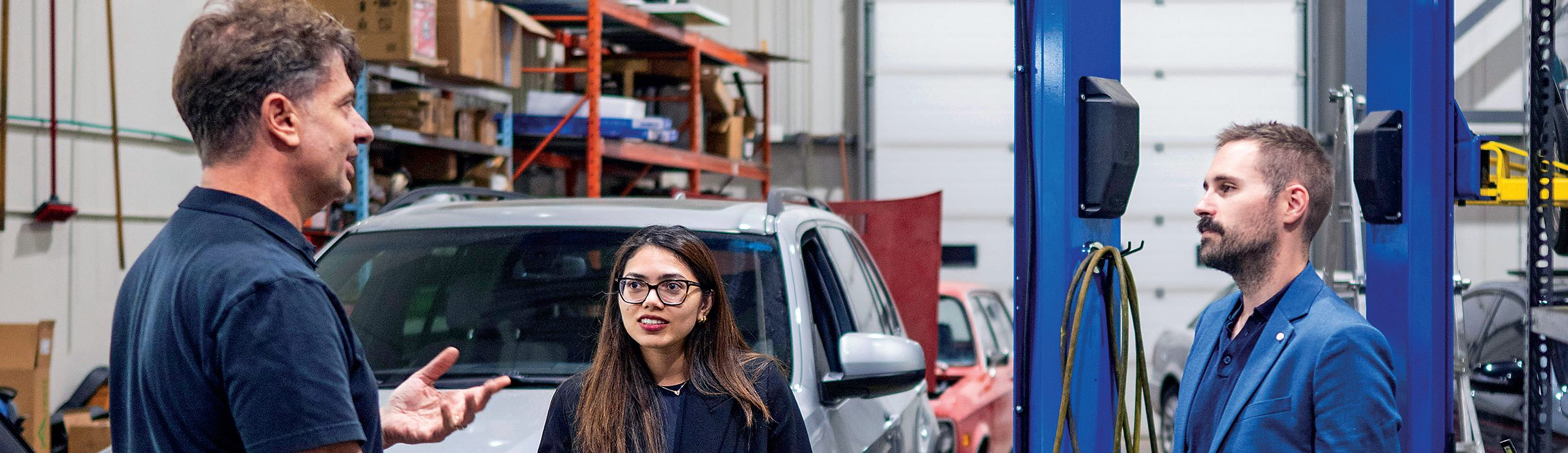 Students Samara Sayeed and Leland Morrison meet with Entrepreneurial Law Clinic client Francesco Auricchiella in his shop