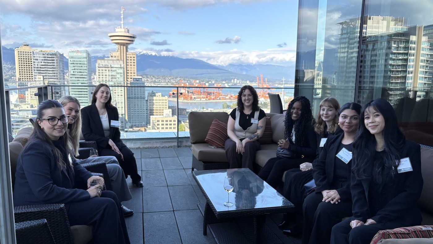 Students during a firm hop on a patio overlooking the CN tower in Toronto