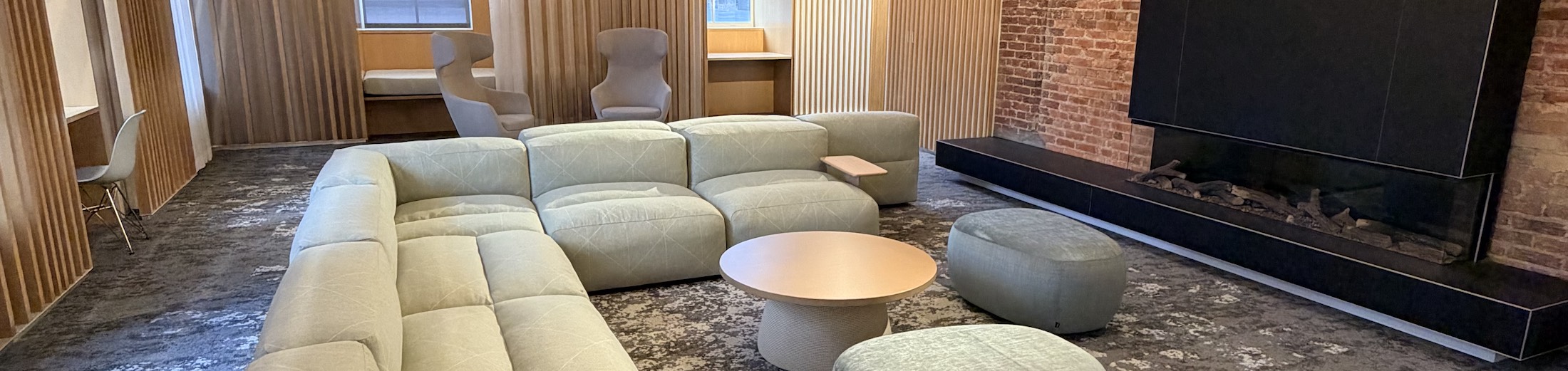 Cubbies with chairs and padded benches near windows in the new UCommons Calm Room