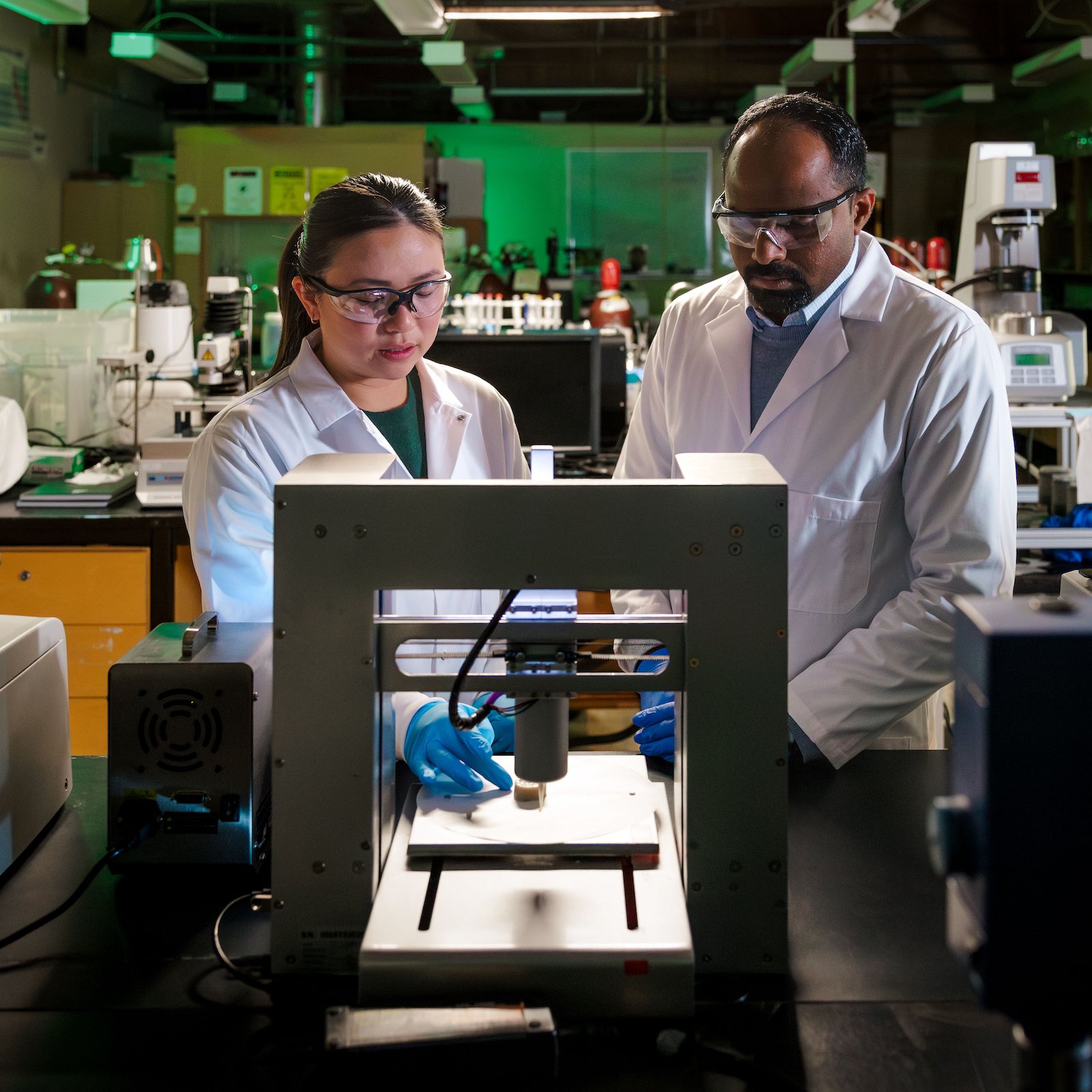 MS Roopesh and a student print food with pea protein on a 3d printer in their lab