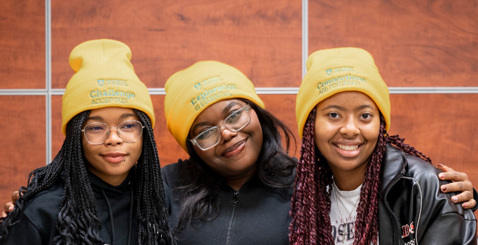 Person climbing on rock wall.
